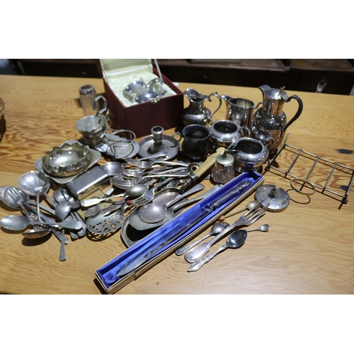 776 - Assortment of silver plate to include a bread knife, jugs, dishes etc