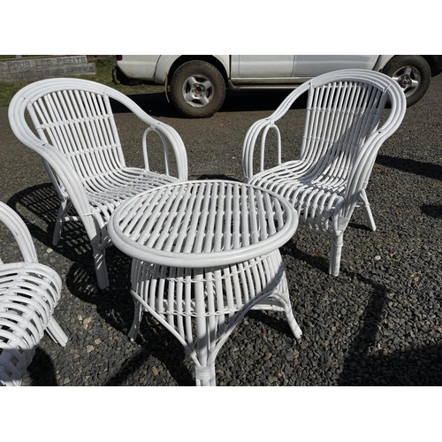 819 - Quality modern white painted cane patio or sunroom suite, comprising three arm chairs and table (4)