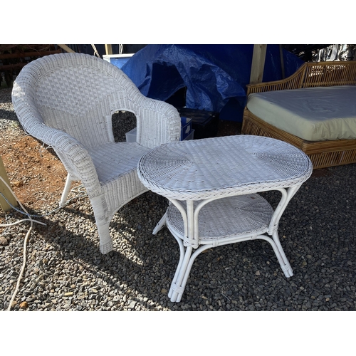 820 - Cane arm chair and table (2)
