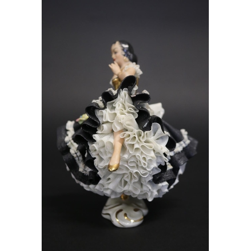 43 - Dresden porcelain figure of a Spanish female dancer, marked to base, approx 16cm H