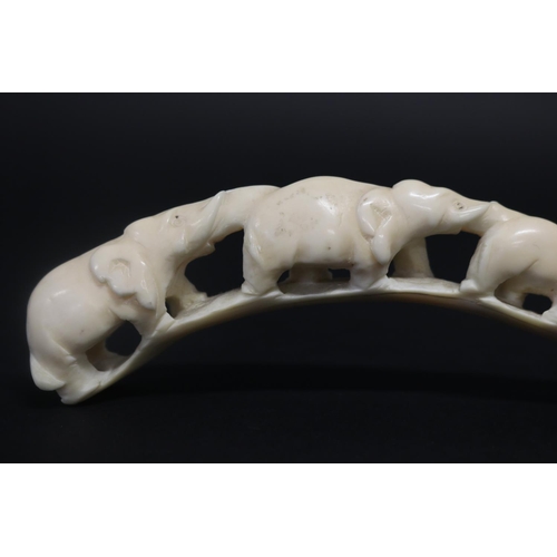 31 - Carved ivory train of elephants, approx 18cm L