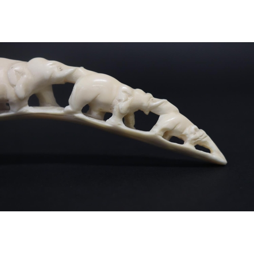 31 - Carved ivory train of elephants, approx 18cm L
