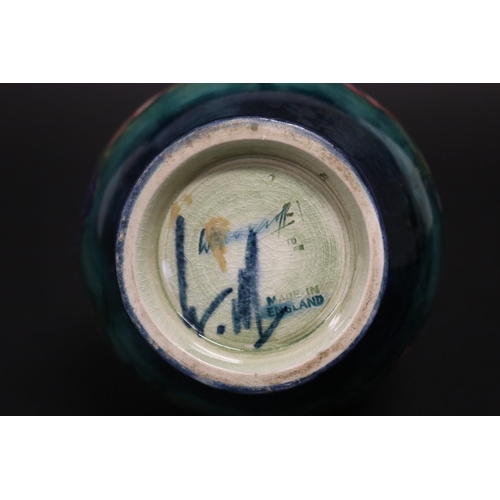 54 - Moorcroft pottery Anemone vase, of green & blue ground, signed William Moorcroft to base, approx 15c... 