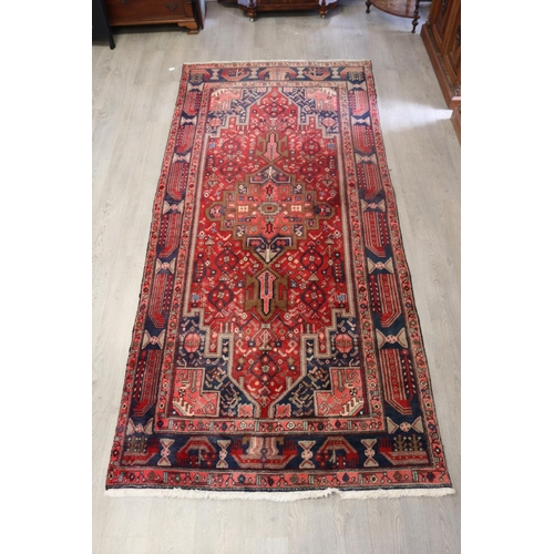 105 - Good Iranian hand knotted wool carpet, approx 319cm x 148cm