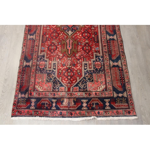 105 - Good Iranian hand knotted wool carpet, approx 319cm x 148cm