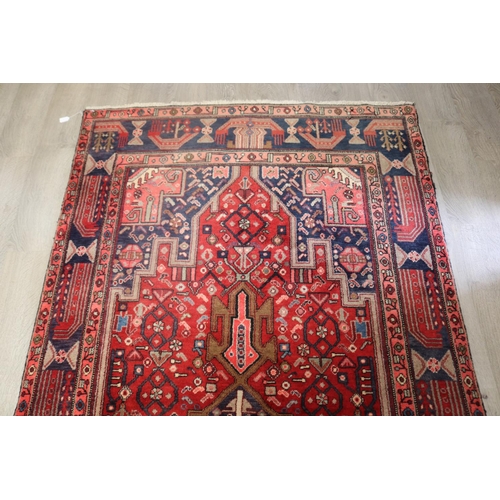 105 - Good Iranian hand knotted wool carpet, approx 319cm x 148cm