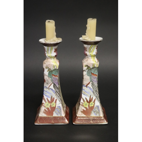 181 - Pair of floral decorated porcelain candlesticks, approx 22cm H (2)