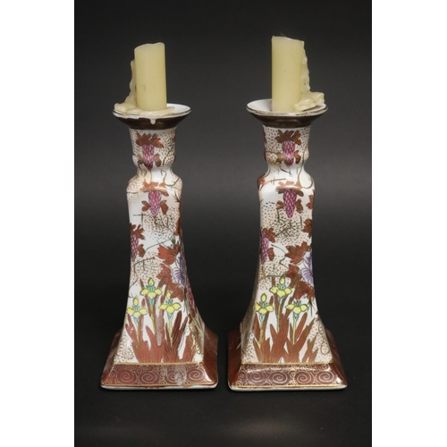 181 - Pair of floral decorated porcelain candlesticks, approx 22cm H (2)