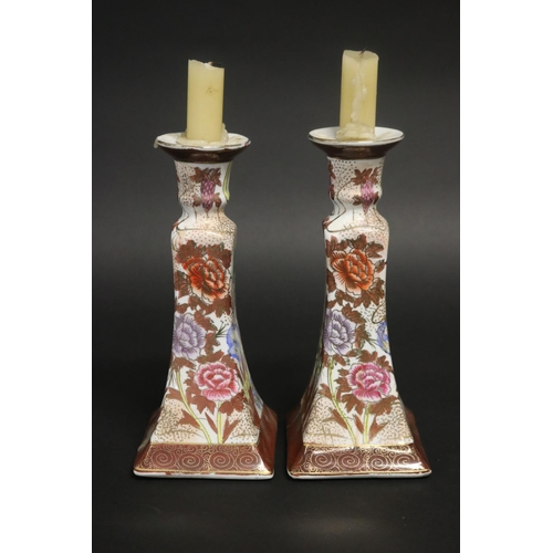 181 - Pair of floral decorated porcelain candlesticks, approx 22cm H (2)