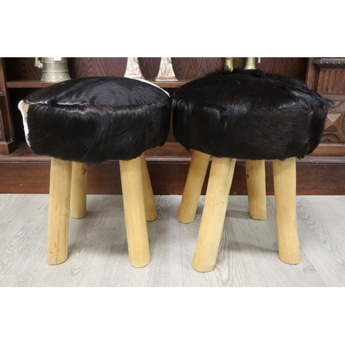 185 - Pair of cow hide four leg stools, each approx 50cm H x 40cm Dia (2)