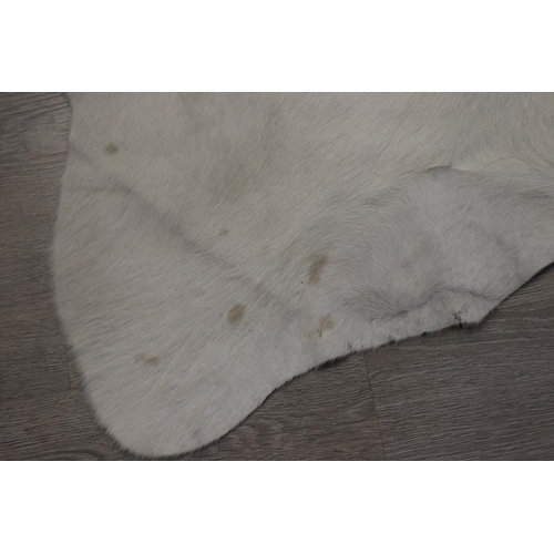 186 - Cow hide floor rug, approx 215cm x 203cm