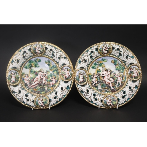 79 - Pair of vintage Capodimonte porcelain hanging plates, each approx 31cm Dia (2)