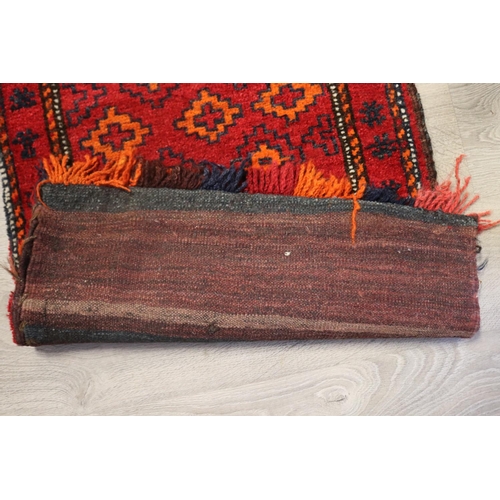 97 - Hand woven wool camel bag carpet, approx 114cm x 61cm