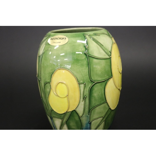 300 - Moorcroft pottery green ground vase, marked to base & paper label, approx 19.5cm H (Af - Cracked)