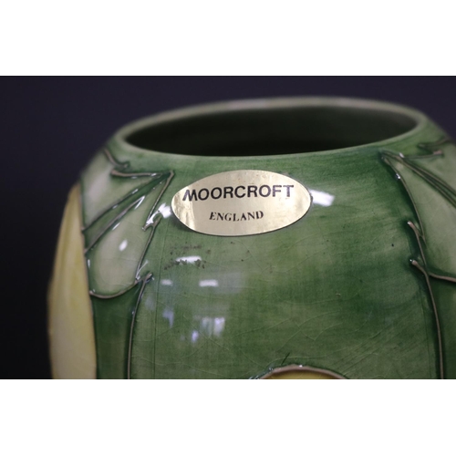 300 - Moorcroft pottery green ground vase, marked to base & paper label, approx 19.5cm H (Af - Cracked)