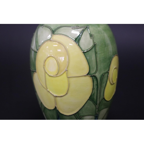 300 - Moorcroft pottery green ground vase, marked to base & paper label, approx 19.5cm H (Af - Cracked)