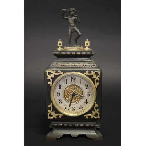 Rare Australian Evan Jones mantle clock surmounted with aboriginal figure throwing boomerang, marked to dial Evan Jones Sydney. Movement number 1304. Case of square shape, with applied brass decoration. Running at time of inspection.