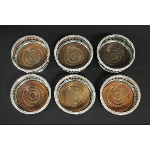 130 - Set of six antique dessert bottle coasters, pierced sides and gadrooned rims, each approx 4cm H x 8c... 