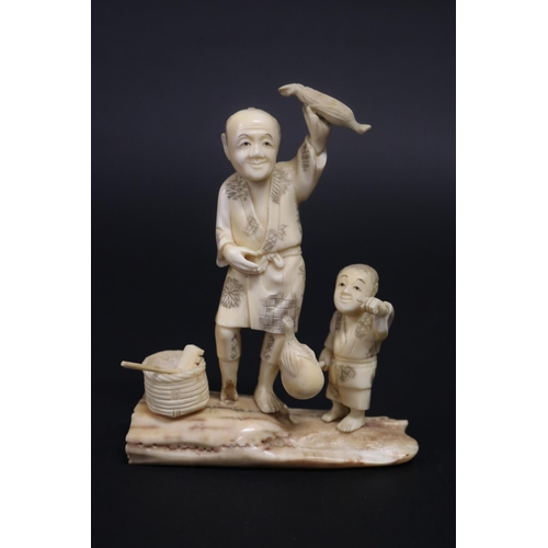 133 - Antique Japanese carved ivory figure group, farmer and boy, signed, approx 14cm H x 11cm W