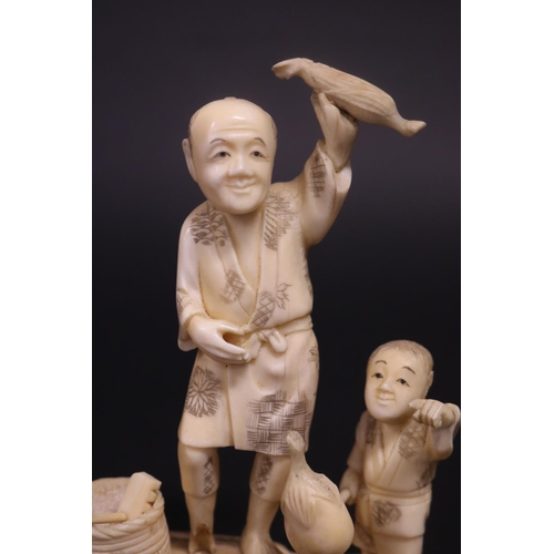 133 - Antique Japanese carved ivory figure group, farmer and boy, signed, approx 14cm H x 11cm W