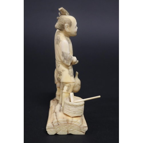 133 - Antique Japanese carved ivory figure group, farmer and boy, signed, approx 14cm H x 11cm W