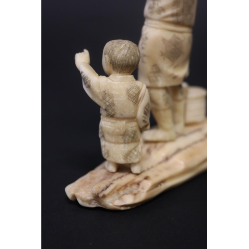 133 - Antique Japanese carved ivory figure group, farmer and boy, signed, approx 14cm H x 11cm W