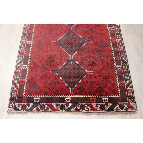 291 - Iranian hand knotted wool carpet, of red ground, approx 193cm x 142cm