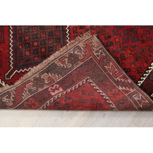 291 - Iranian hand knotted wool carpet, of red ground, approx 193cm x 142cm