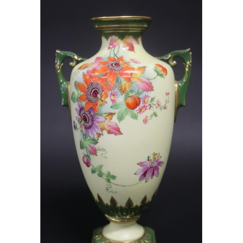 317 - Twin handled pedestal vase, with hand painted floral decoration, marked Worcester to base, 28cm H