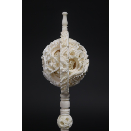 325 - Large Chinese carved ivory puzzle ball, carved with dragons, approx 29cm H