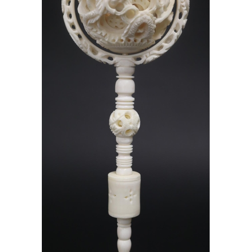 325 - Large Chinese carved ivory puzzle ball, carved with dragons, approx 29cm H