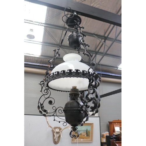 433 - Dutch colonial style black painted metal banquet lamp, with height adjustable weight, central milk g... 