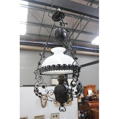 433 - Dutch colonial style black painted metal banquet lamp, with height adjustable weight, central milk g... 