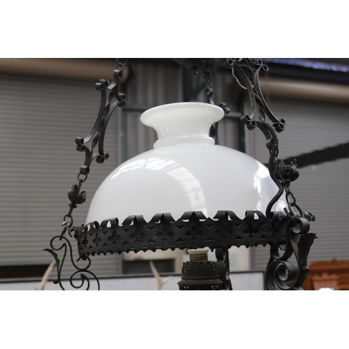 433 - Dutch colonial style black painted metal banquet lamp, with height adjustable weight, central milk g... 