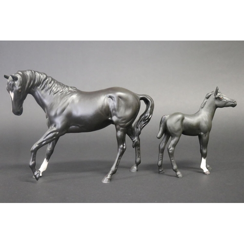 310 - Three medium sized Beswick horses, one in grey white the other back, approx 17.5cm H & 19cm H (3)