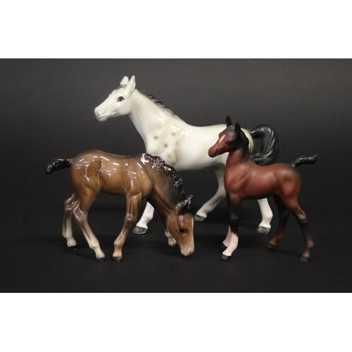 311 - Three small Beswick horse figures, approx 8.5cm H, 11.5cm H & 12.5cm H (3)