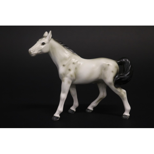 311 - Three small Beswick horse figures, approx 8.5cm H, 11.5cm H & 12.5cm H (3)