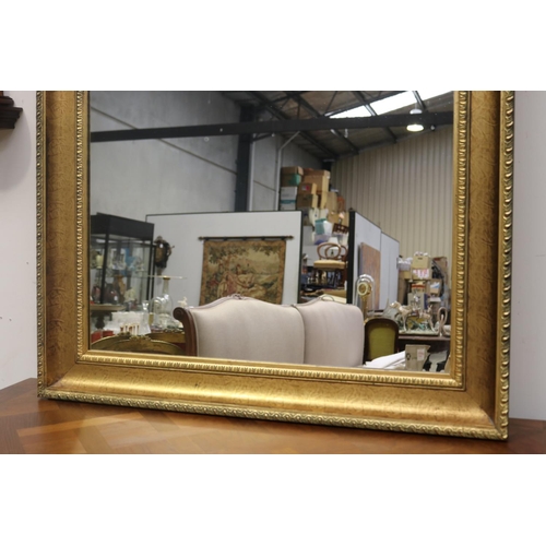 373 - Modern large gilt surround mirror, approx 152cm x 95cm