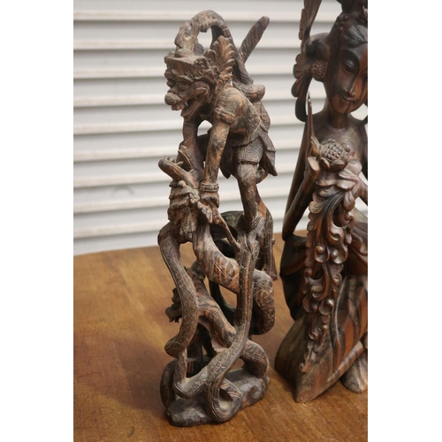 423 - Four carved hardwood South East Asian figures, approx 50cm H and shorter (4)