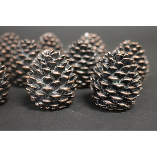 348 - Array of decorative pine cones place settings