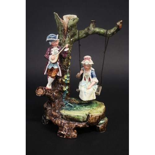 402 - Majolica courting couple on swing, approx 26cm H