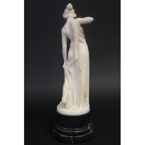 450 - Antique carved alabaster figure of a semi clad female, standing on a black marble base, unsigned. Ap... 