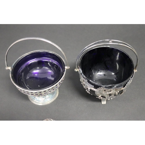 488 - Two EPNS & blue glass liner bowls with swing handles, along with a matched spoon, approx 10cm H excl... 