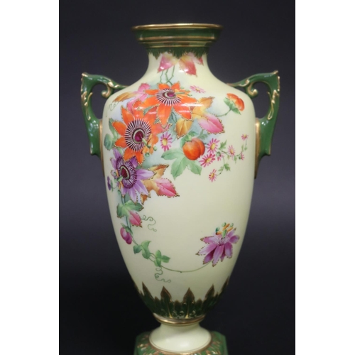 76 - Twin handled pedestal vase, with hand painted floral decoration, marked Worcester to base, approx 28... 