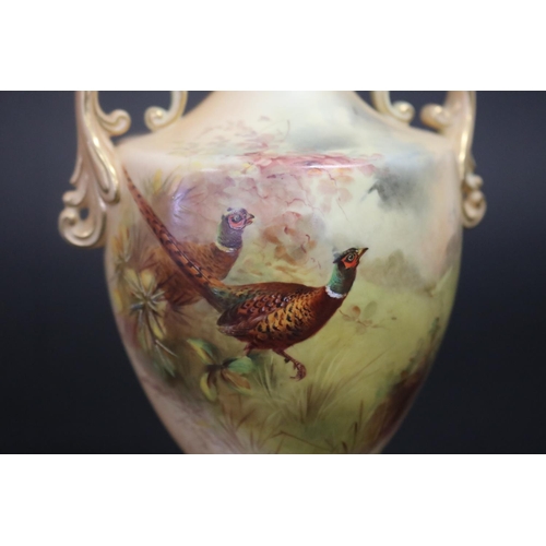107 - Royal China Works Worcester blush ivory twin handled vase, with hand painted pheasants to front pane... 