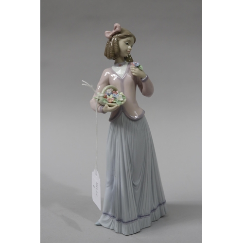 136 - Lladro porcelain figure of a girl with basket of flowers F 12J, approx 25 cm high