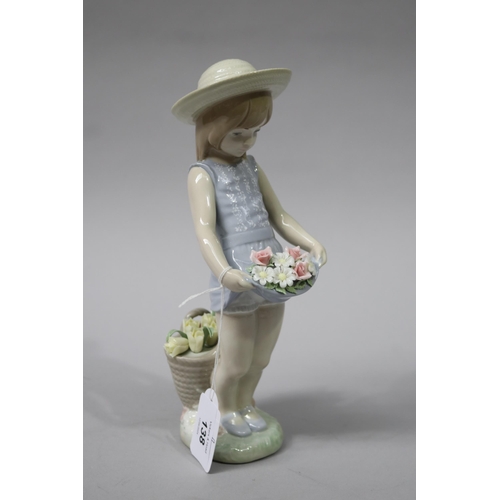 138 - Lladro porcelain young girl with flowers 1284, approx 22cm H