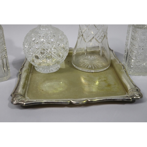 28 - Silver plated square shape tray along with four cut crystal decanters, approx 31cm H and shorter (5)