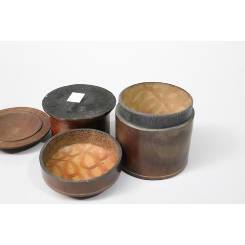 96 - Two lidded jars, one of treen, the other calf leather made in Florence approx 10cm H and shorter (2)