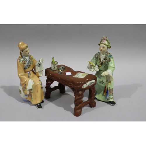 170 - Two Chinese figures with a table, approx 22cm H and shorter (3)